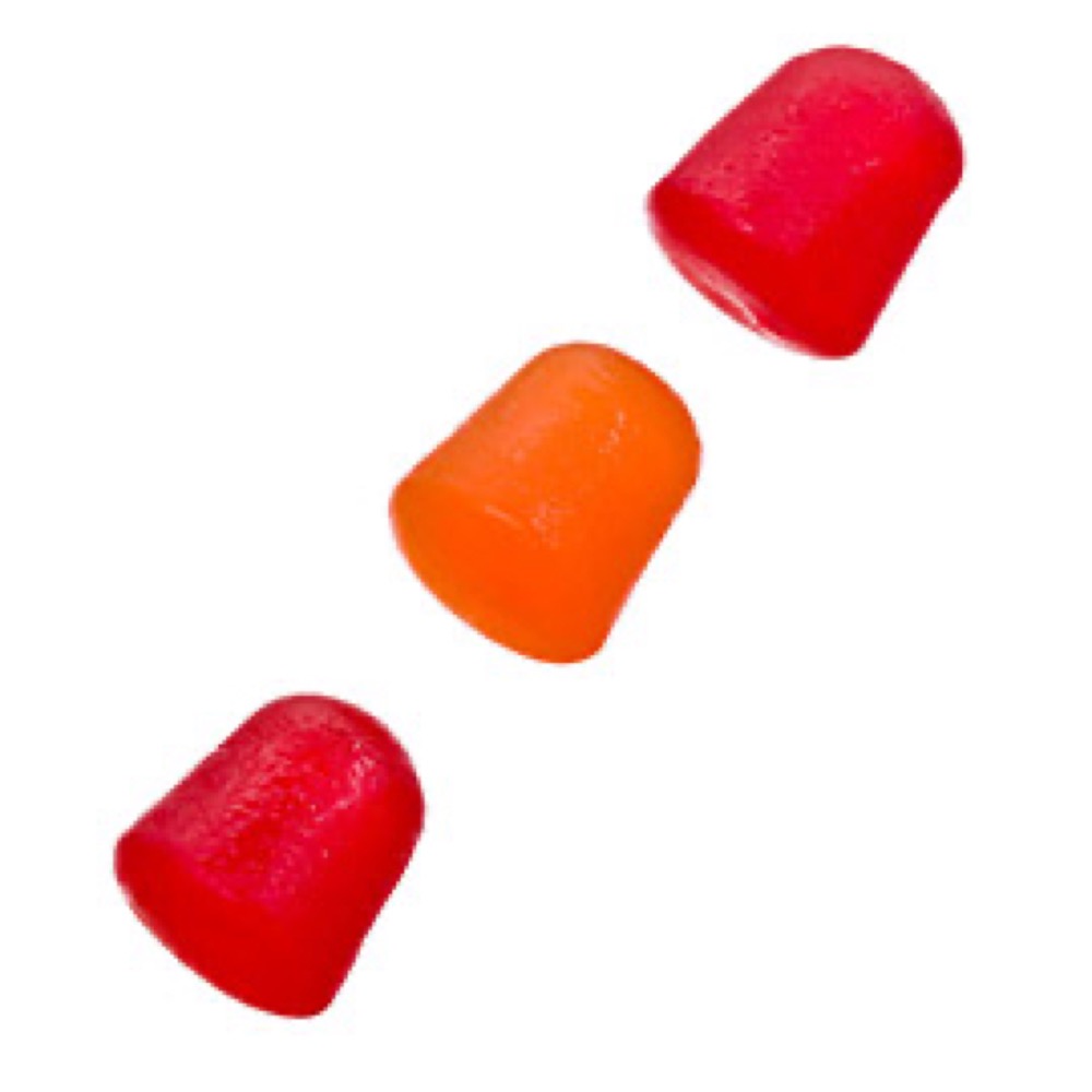 Three bell-shaped gummies, two red and one orange, against a white background.